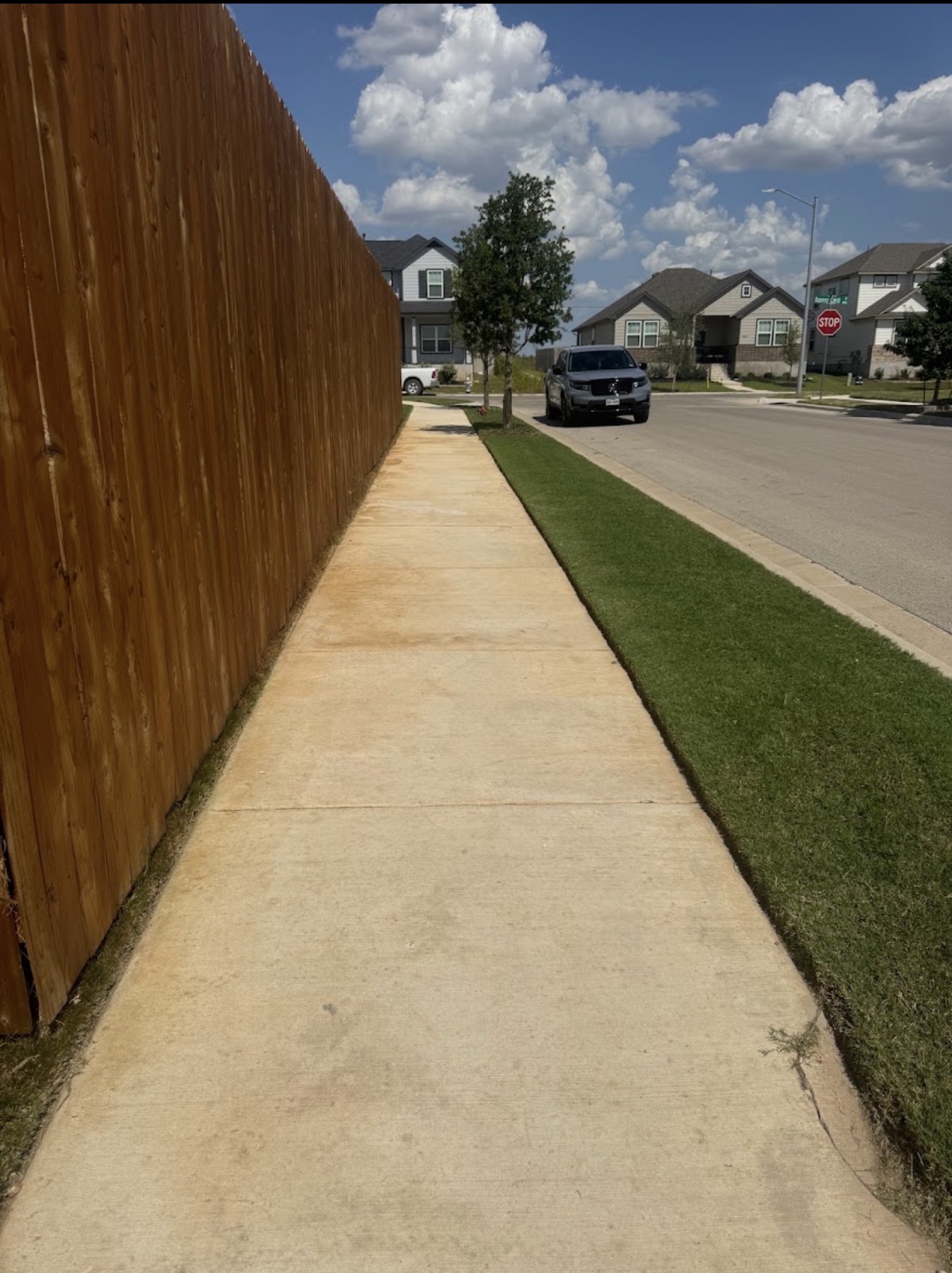 Clean lawn edging beside sidewalk